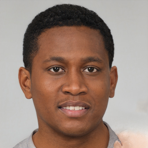 Neutral black young-adult male with short  brown hair and brown eyes