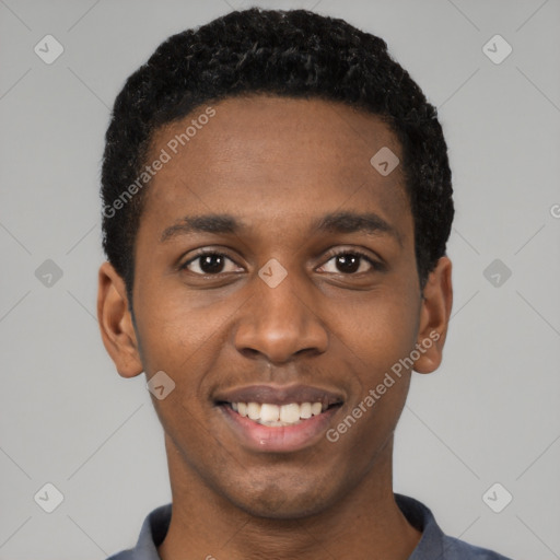 Joyful black young-adult male with short  black hair and brown eyes