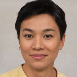 Joyful asian young-adult female with short  brown hair and brown eyes