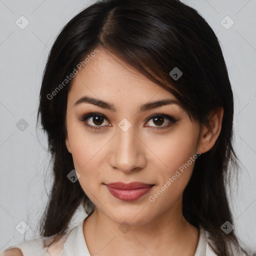 Joyful latino young-adult female with medium  brown hair and brown eyes