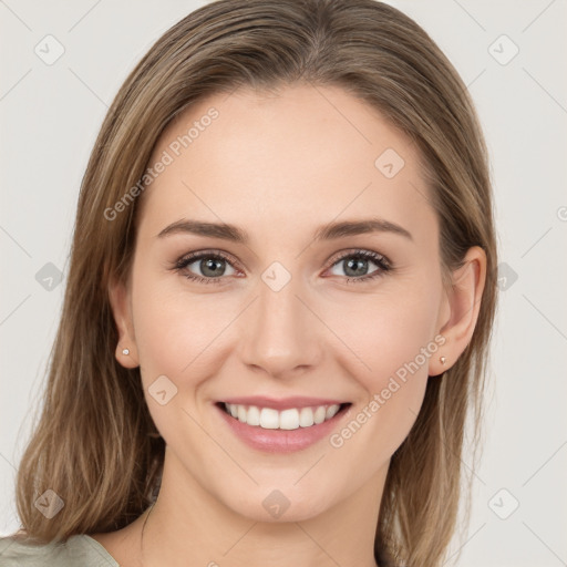 Joyful white young-adult female with medium  brown hair and green eyes