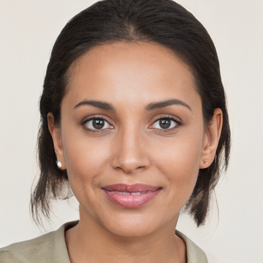 Joyful white young-adult female with medium  brown hair and brown eyes