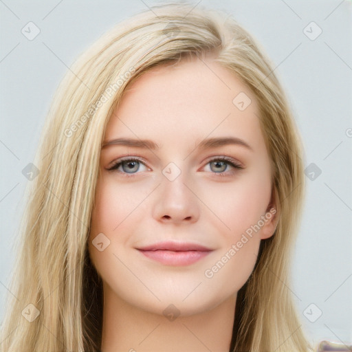 Joyful white young-adult female with long  brown hair and blue eyes