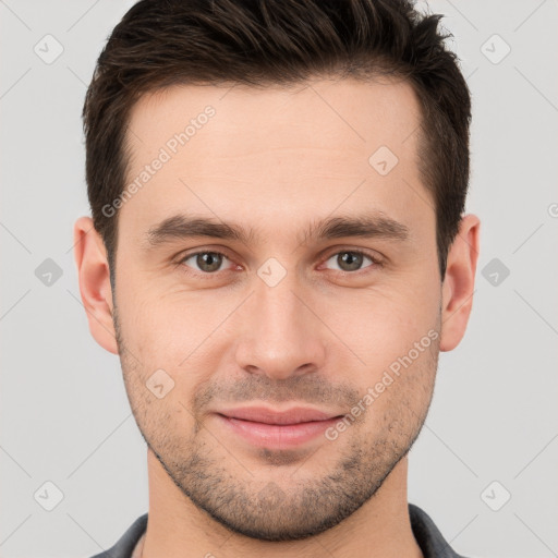 Joyful white young-adult male with short  brown hair and brown eyes