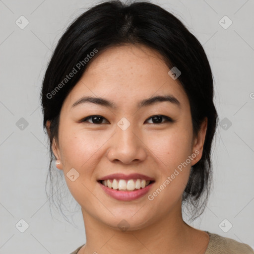 Joyful asian young-adult female with medium  black hair and brown eyes