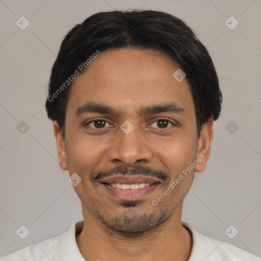 Joyful latino young-adult male with short  black hair and brown eyes