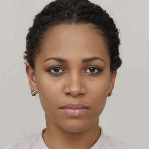 Neutral black young-adult female with short  brown hair and brown eyes