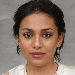 Joyful white young-adult female with medium  brown hair and brown eyes