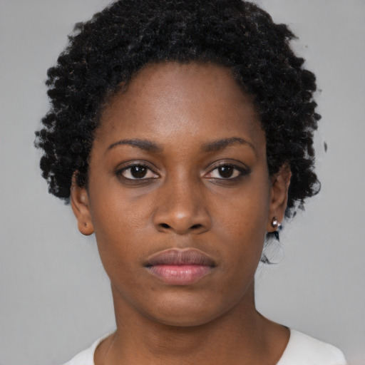 Neutral black young-adult female with short  brown hair and brown eyes