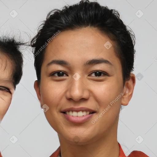 Joyful asian young-adult female with short  brown hair and brown eyes