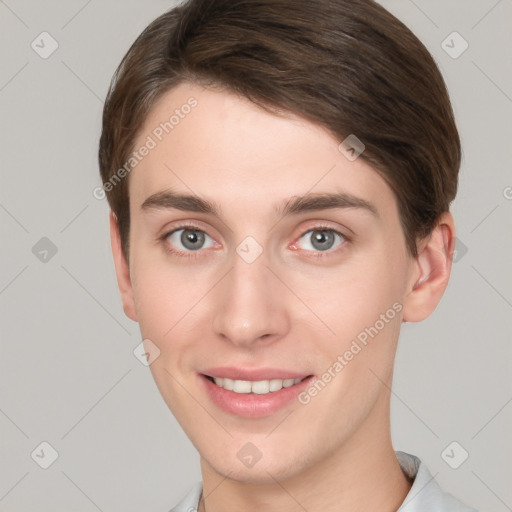 Joyful white young-adult female with short  brown hair and grey eyes