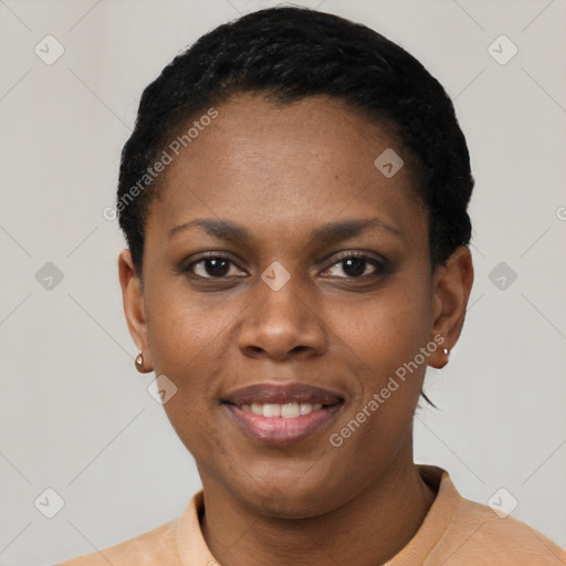 Joyful black young-adult female with short  black hair and brown eyes