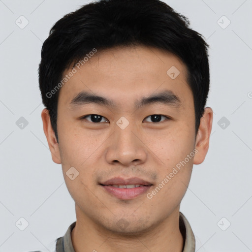 Joyful asian young-adult male with short  black hair and brown eyes