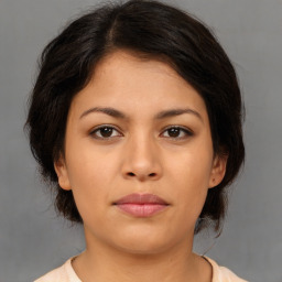 Neutral asian young-adult female with medium  brown hair and brown eyes