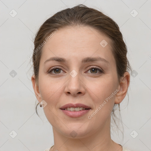 Joyful white young-adult female with medium  brown hair and grey eyes