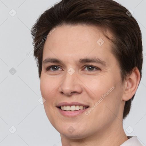 Joyful white young-adult female with short  brown hair and brown eyes