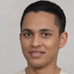 Joyful latino young-adult male with short  black hair and brown eyes