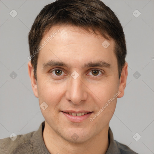 Joyful white adult male with short  brown hair and brown eyes