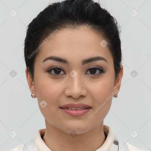 Joyful latino young-adult female with short  brown hair and brown eyes