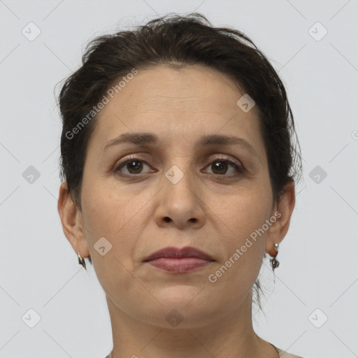 Joyful white adult female with short  brown hair and brown eyes