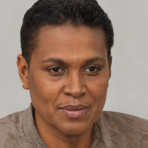 Joyful black adult male with short  brown hair and brown eyes