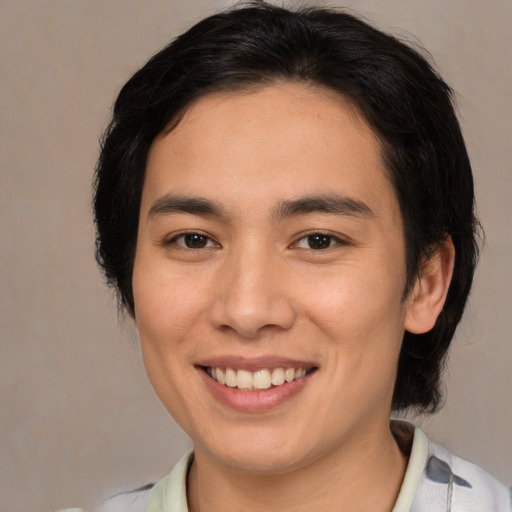 Joyful asian young-adult female with medium  brown hair and brown eyes