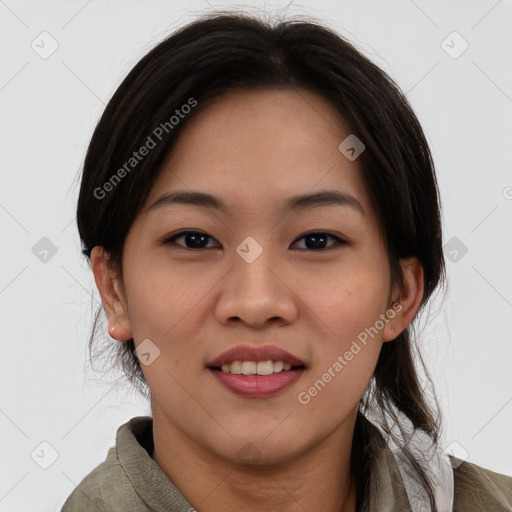 Joyful latino young-adult female with medium  brown hair and brown eyes