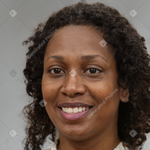 Joyful black adult female with medium  brown hair and brown eyes