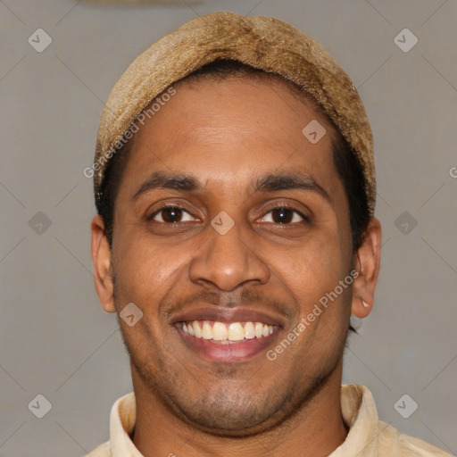 Joyful latino young-adult male with short  brown hair and brown eyes