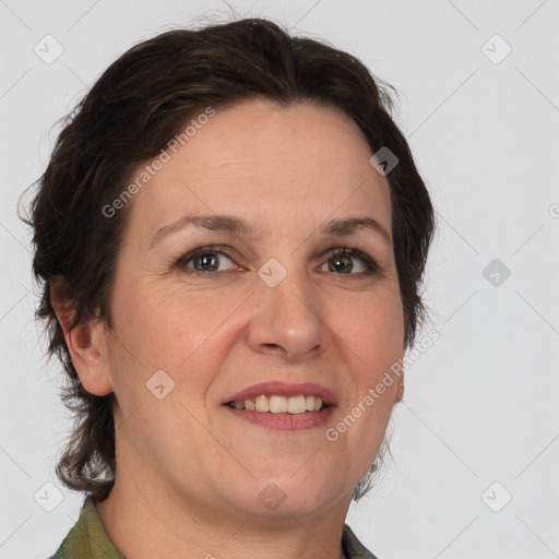 Joyful white adult female with medium  brown hair and grey eyes