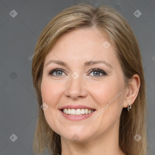 Joyful white adult female with long  brown hair and grey eyes