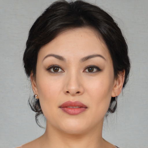 Joyful asian young-adult female with medium  brown hair and brown eyes