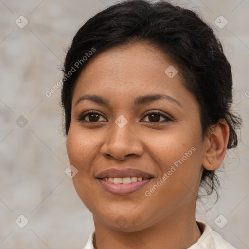 Joyful latino young-adult female with short  brown hair and brown eyes