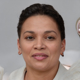 Joyful white adult female with short  brown hair and brown eyes