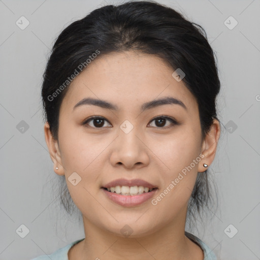 Joyful asian young-adult female with medium  black hair and brown eyes