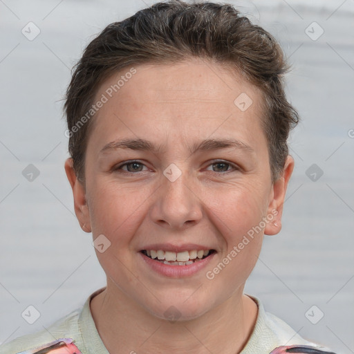 Joyful white young-adult female with short  brown hair and grey eyes