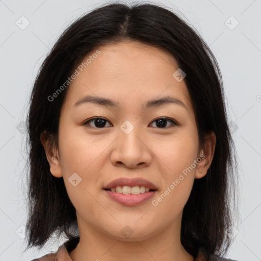 Joyful asian young-adult female with medium  brown hair and brown eyes