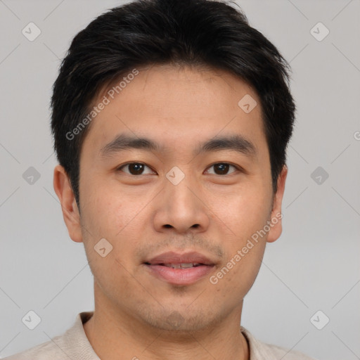 Joyful asian young-adult male with short  brown hair and brown eyes