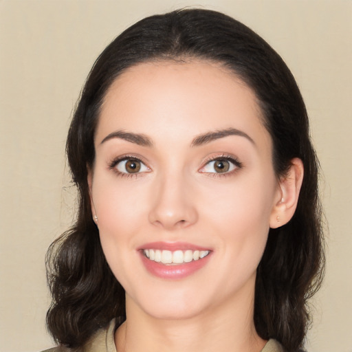 Joyful white young-adult female with medium  black hair and brown eyes