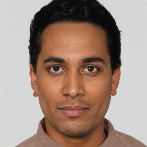 Neutral latino young-adult male with short  black hair and brown eyes