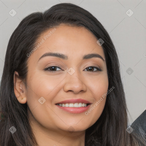 Joyful latino young-adult female with long  brown hair and brown eyes