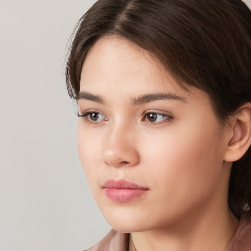 Neutral white young-adult female with long  brown hair and brown eyes