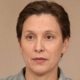 Joyful white adult female with medium  brown hair and grey eyes