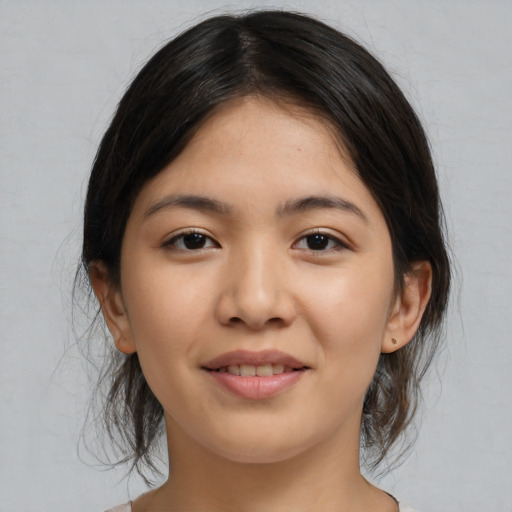 Joyful white young-adult female with medium  black hair and brown eyes