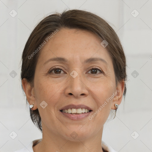 Joyful white adult female with medium  brown hair and brown eyes