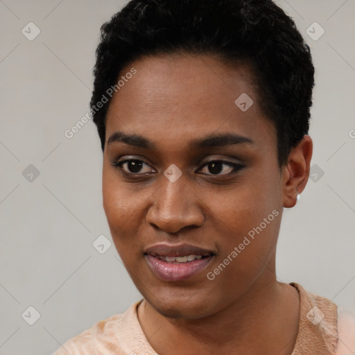 Joyful black young-adult female with short  black hair and brown eyes