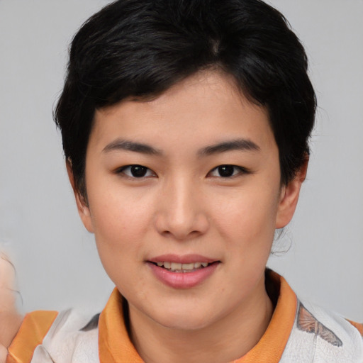 Joyful asian young-adult female with medium  black hair and brown eyes