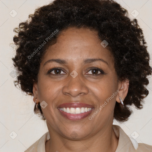 Joyful black adult female with medium  brown hair and brown eyes