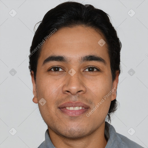 Joyful latino young-adult male with short  black hair and brown eyes