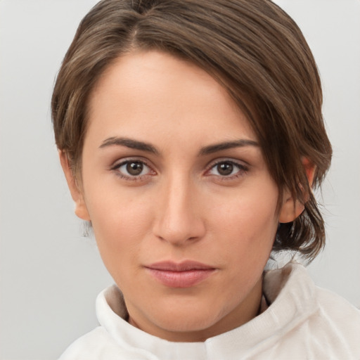 Neutral white young-adult female with short  brown hair and brown eyes